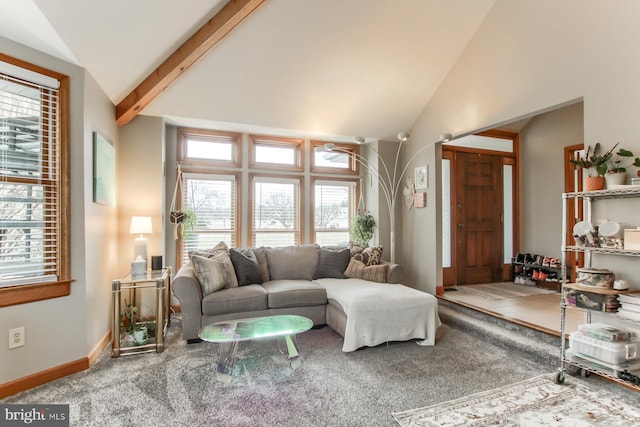 carpeted living area featuring beamed ceiling, baseboards, and high vaulted ceiling