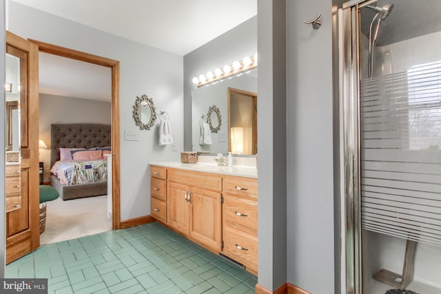 full bathroom featuring connected bathroom, baseboards, and vanity