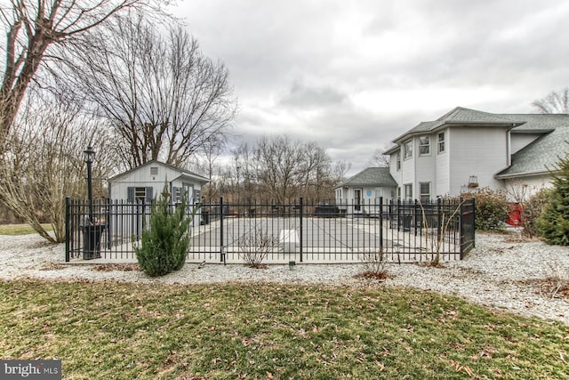 exterior space with an outbuilding and fence