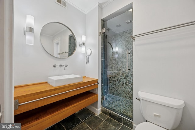 bathroom featuring visible vents, toilet, ornamental molding, vanity, and a shower stall