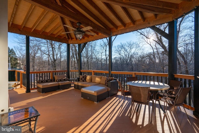 deck featuring outdoor lounge area, outdoor dining space, and ceiling fan