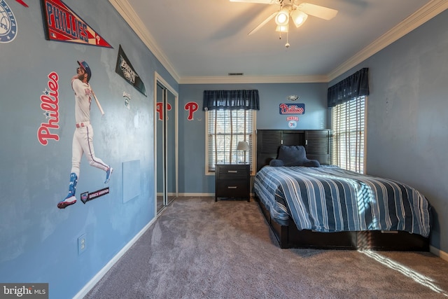 unfurnished bedroom featuring baseboards, multiple windows, ornamental molding, and carpet flooring