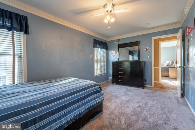 bedroom featuring visible vents, ceiling fan, baseboards, ornamental molding, and carpet floors