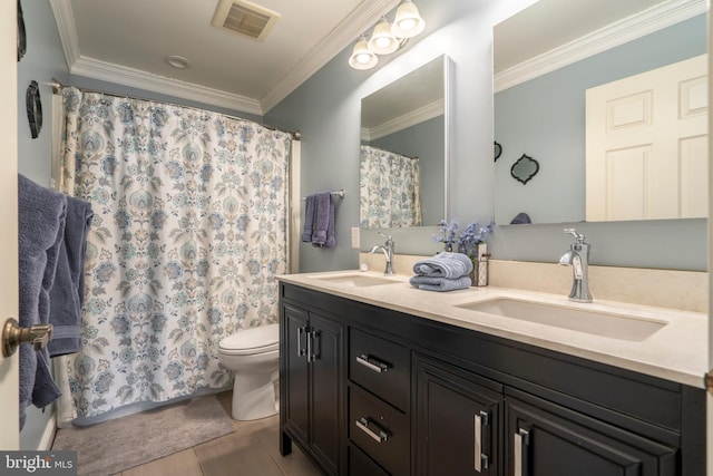 full bathroom featuring a sink, toilet, double vanity, and crown molding