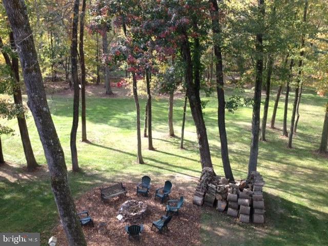 view of yard with an outdoor fire pit