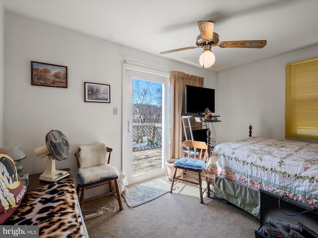 bedroom with access to outside, a ceiling fan, and carpet floors