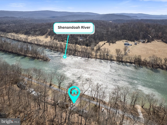 aerial view featuring a water and mountain view