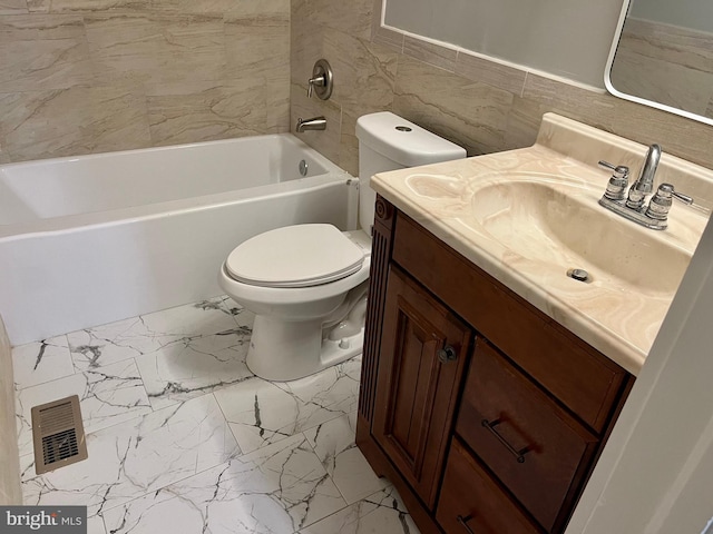 bathroom featuring toilet, vanity, visible vents, tile walls, and marble finish floor