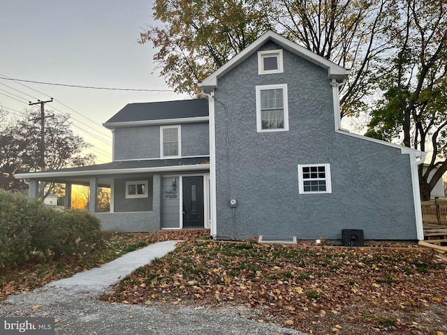 traditional-style house with stucco siding