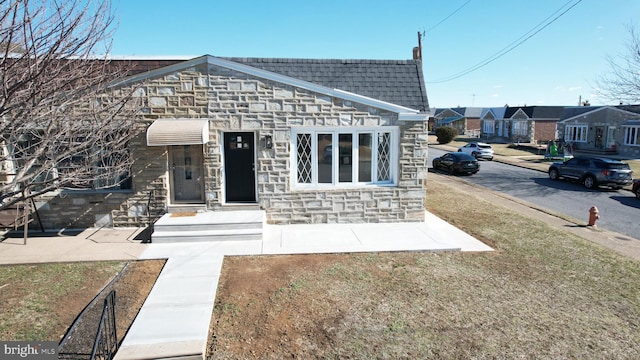 view of front of house with stone siding