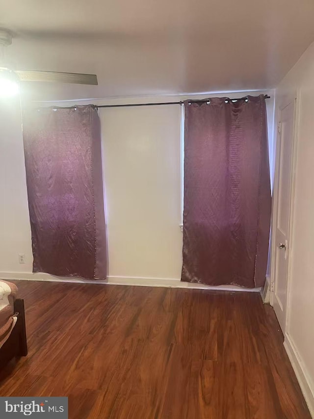 spare room with wood finished floors