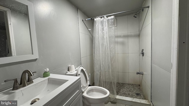 full bath featuring vanity, a shower stall, and toilet