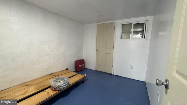 interior space featuring finished concrete flooring