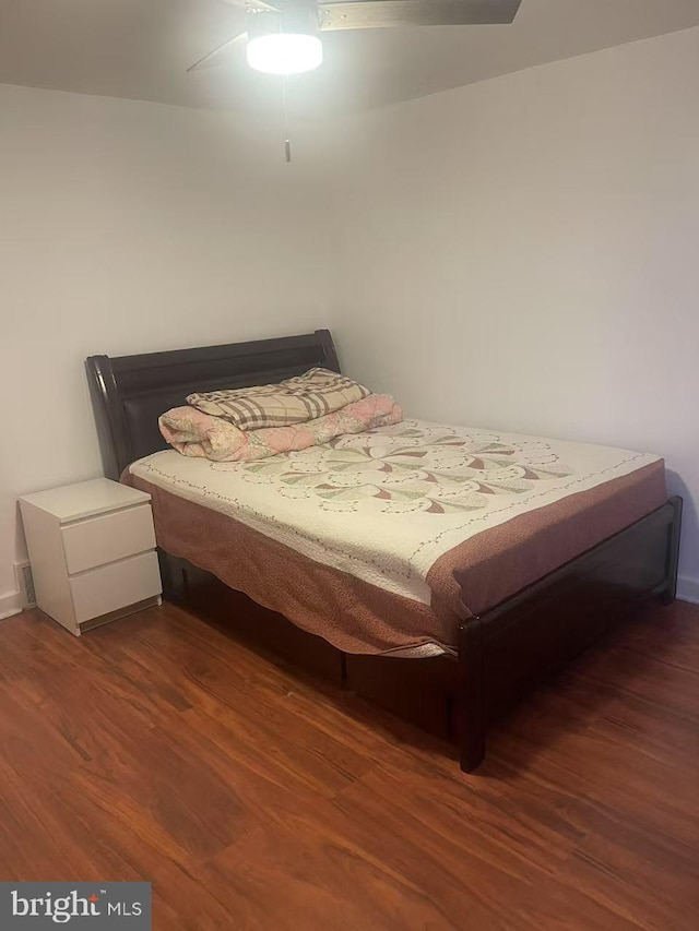 bedroom with wood finished floors and a ceiling fan