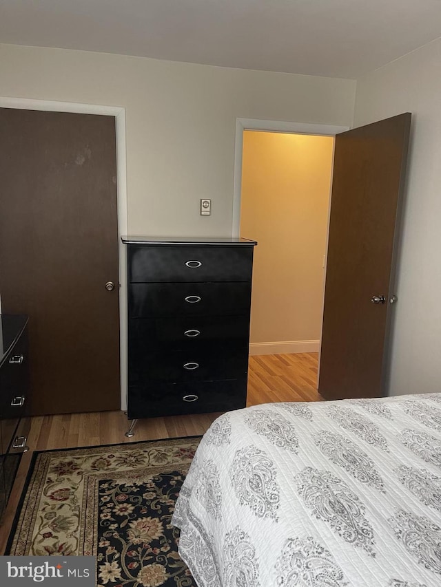 bedroom with wood finished floors