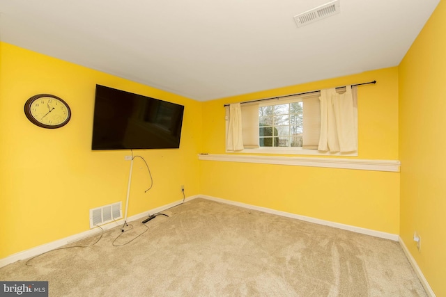 interior space with baseboards, visible vents, and carpet flooring