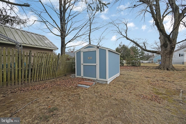 view of shed with fence