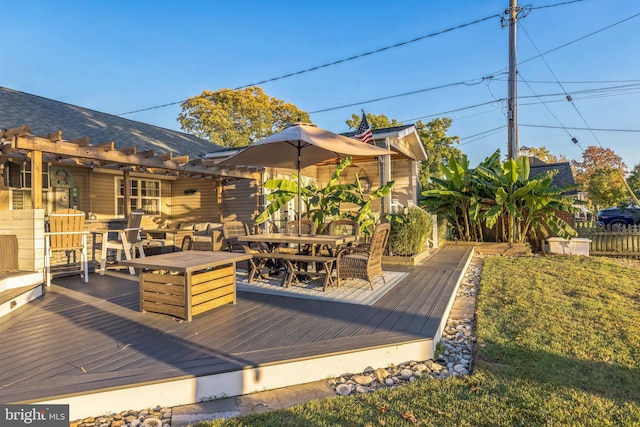 wooden terrace featuring outdoor lounge area and outdoor dining space