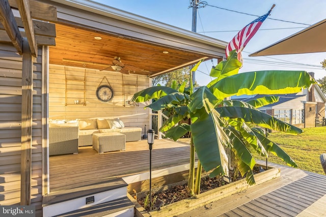 wooden deck featuring a ceiling fan and outdoor lounge area