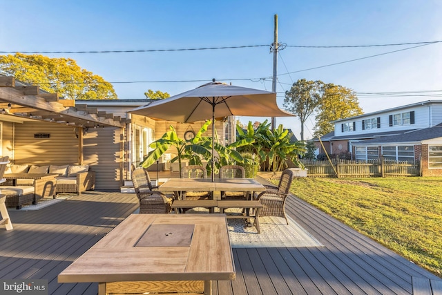 wooden deck with outdoor dining area, fence, and an outdoor living space