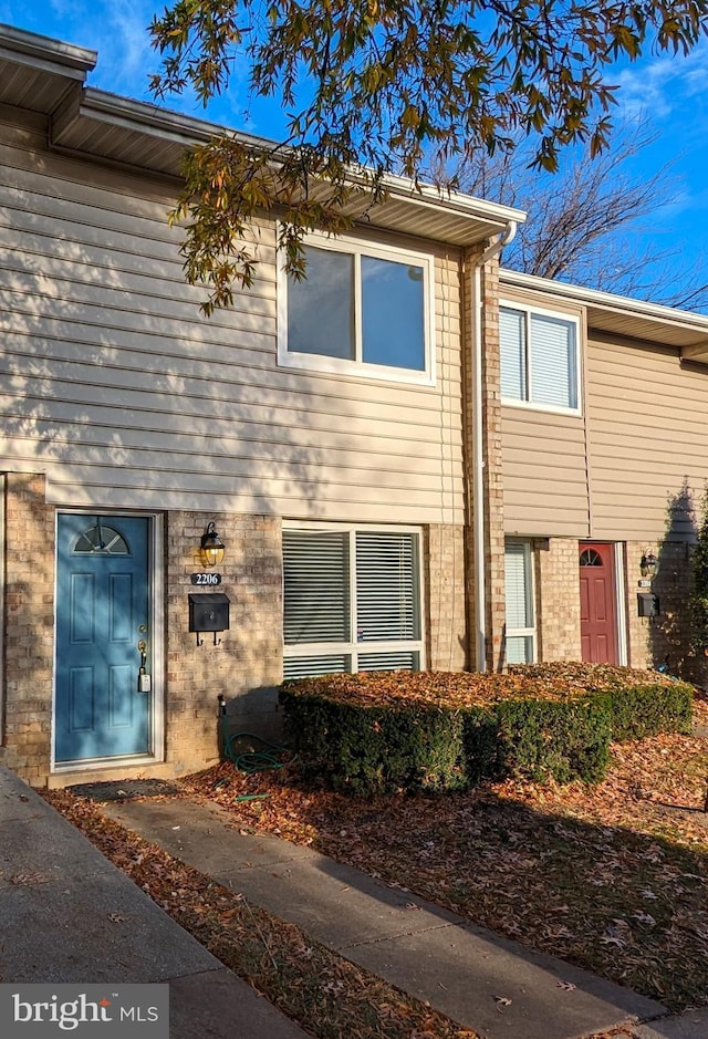 exterior space featuring brick siding