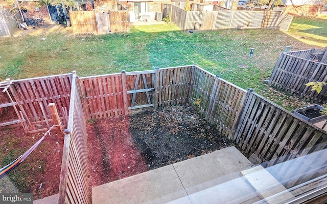 exterior space featuring a fenced backyard