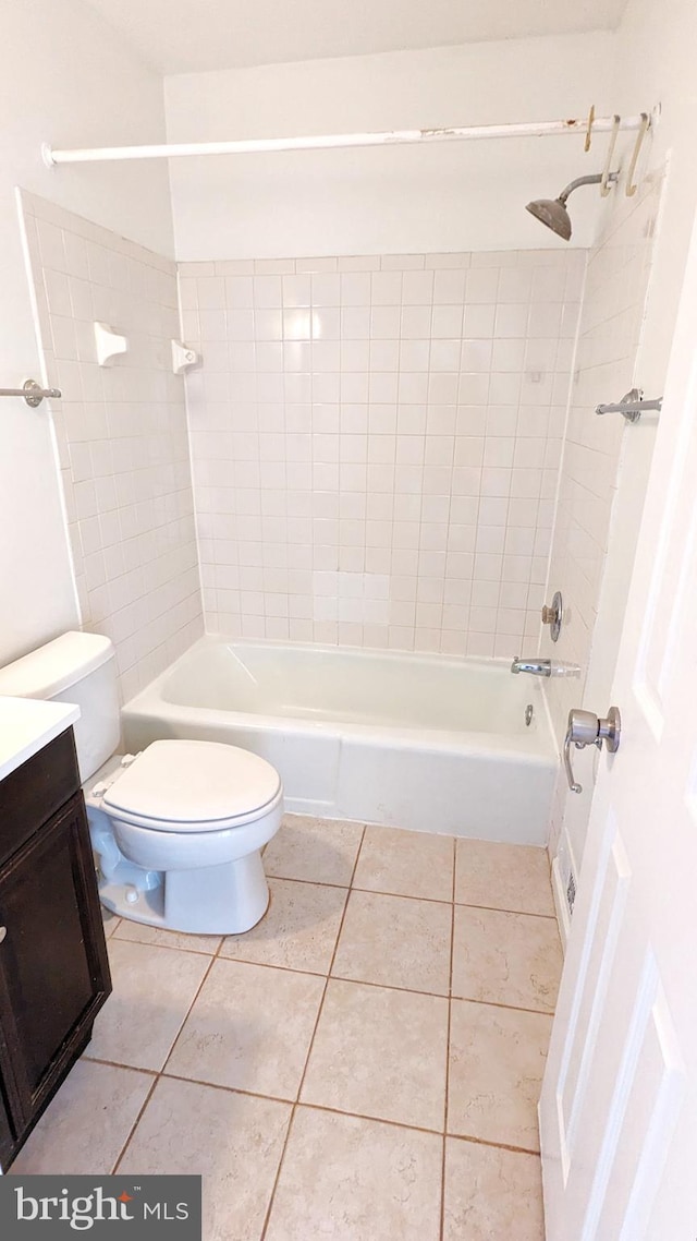 bathroom with toilet, shower / bath combination, vanity, and tile patterned floors