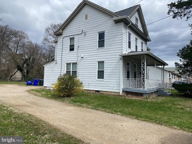 view of property exterior with a porch