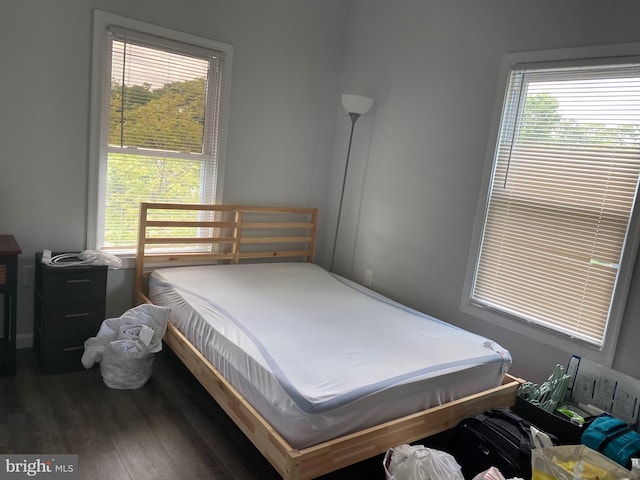 bedroom featuring wood finished floors