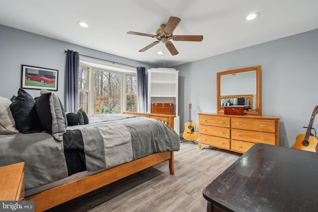 bedroom with ceiling fan, recessed lighting, and light wood-style floors