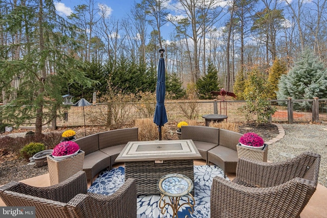 view of patio / terrace featuring fence and outdoor lounge area