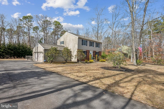 colonial home featuring brick siding