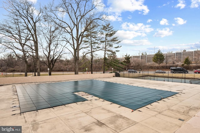 view of pool with a patio area, fence, and a fenced in pool