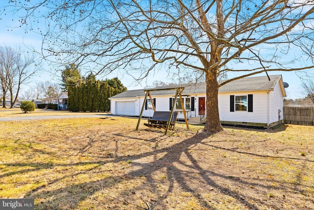 ranch-style house with an attached garage, crawl space, and fence