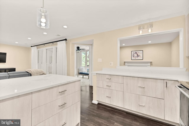 kitchen featuring dark wood-type flooring, light brown cabinetry, open floor plan, light stone counters, and modern cabinets