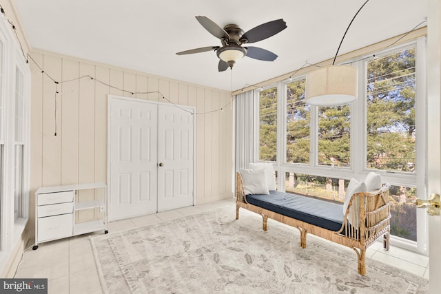 sitting room with tile patterned flooring, plenty of natural light, and ceiling fan