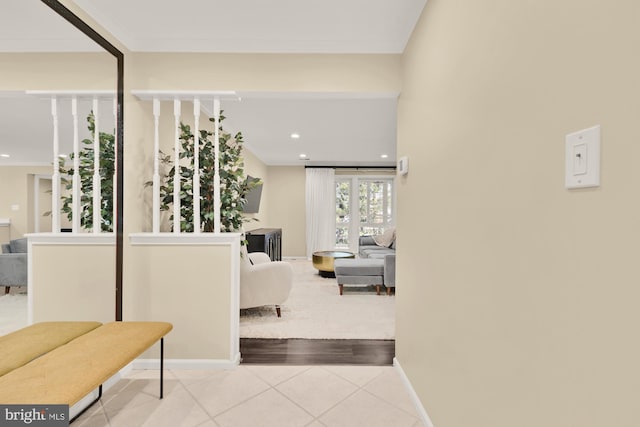 hallway with recessed lighting, baseboards, and tile patterned flooring