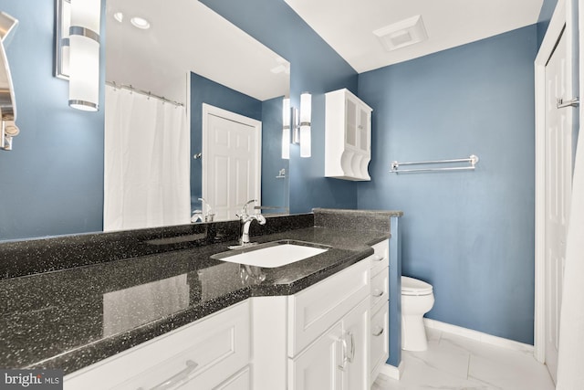 full bathroom featuring marble finish floor, toilet, vanity, and baseboards