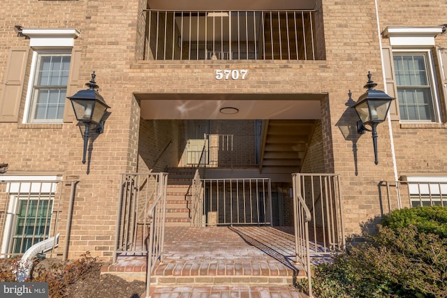 property entrance with brick siding