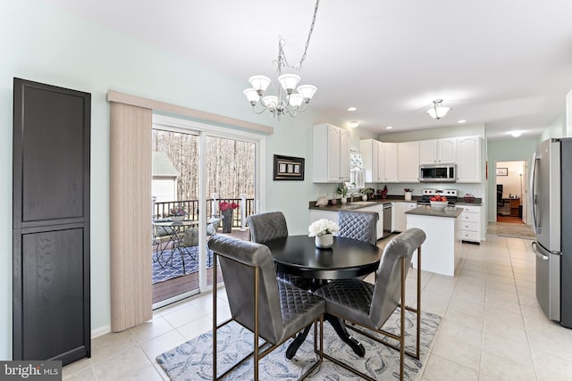 dining area with light tile patterned floors, recessed lighting, and an inviting chandelier