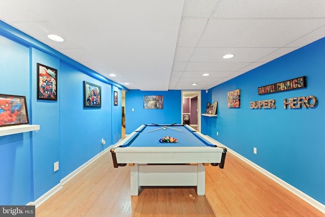 game room featuring a paneled ceiling, pool table, baseboards, and wood finished floors