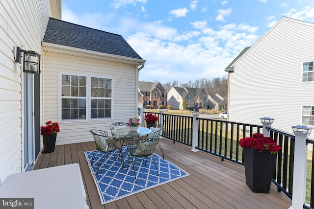 wooden deck featuring a residential view