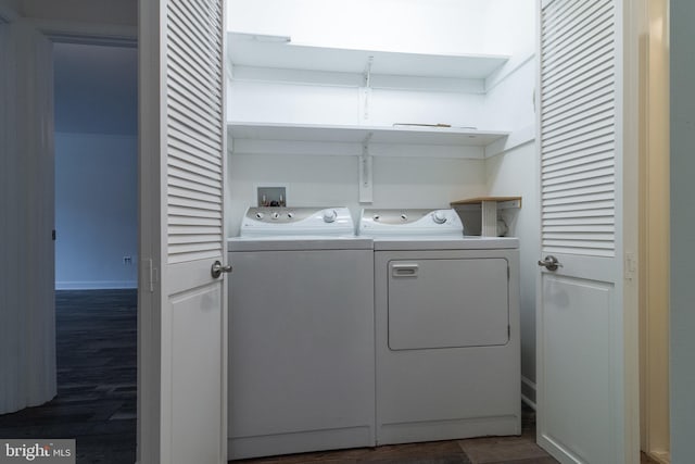 laundry area featuring laundry area, dark wood-style flooring, and washer and dryer