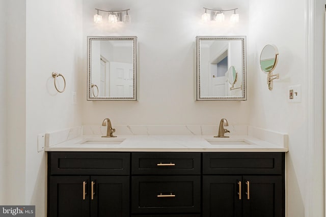 full bath featuring double vanity and a sink