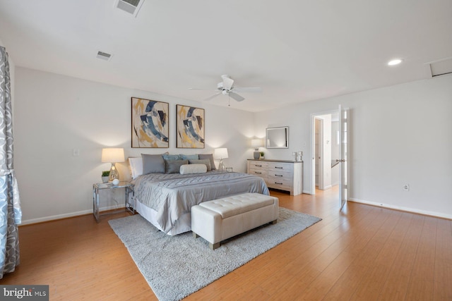 bedroom with visible vents, a ceiling fan, light wood-type flooring, and baseboards