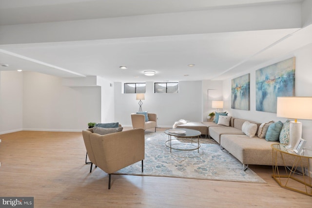 living area with wood finished floors and baseboards