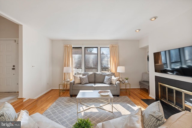 living room featuring baseboards and wood finished floors