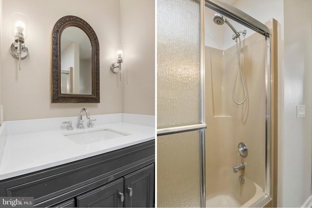 bathroom featuring enclosed tub / shower combo and vanity