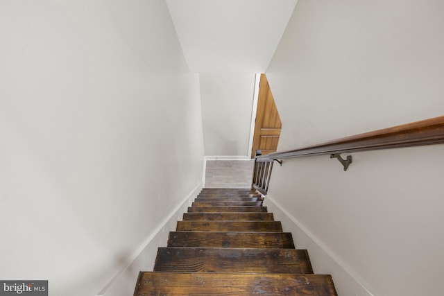 stairs with wood finished floors