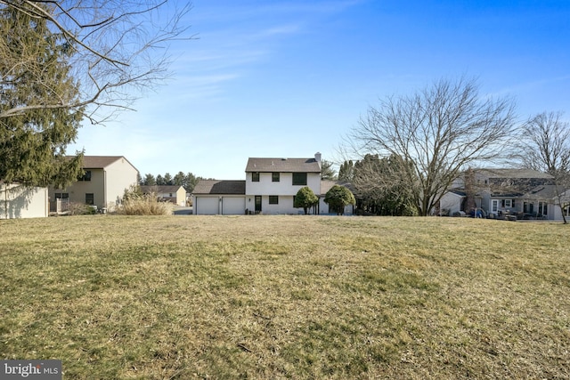 view of yard featuring an attached garage